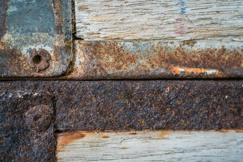 a picture of rusted steel on a wooden surface