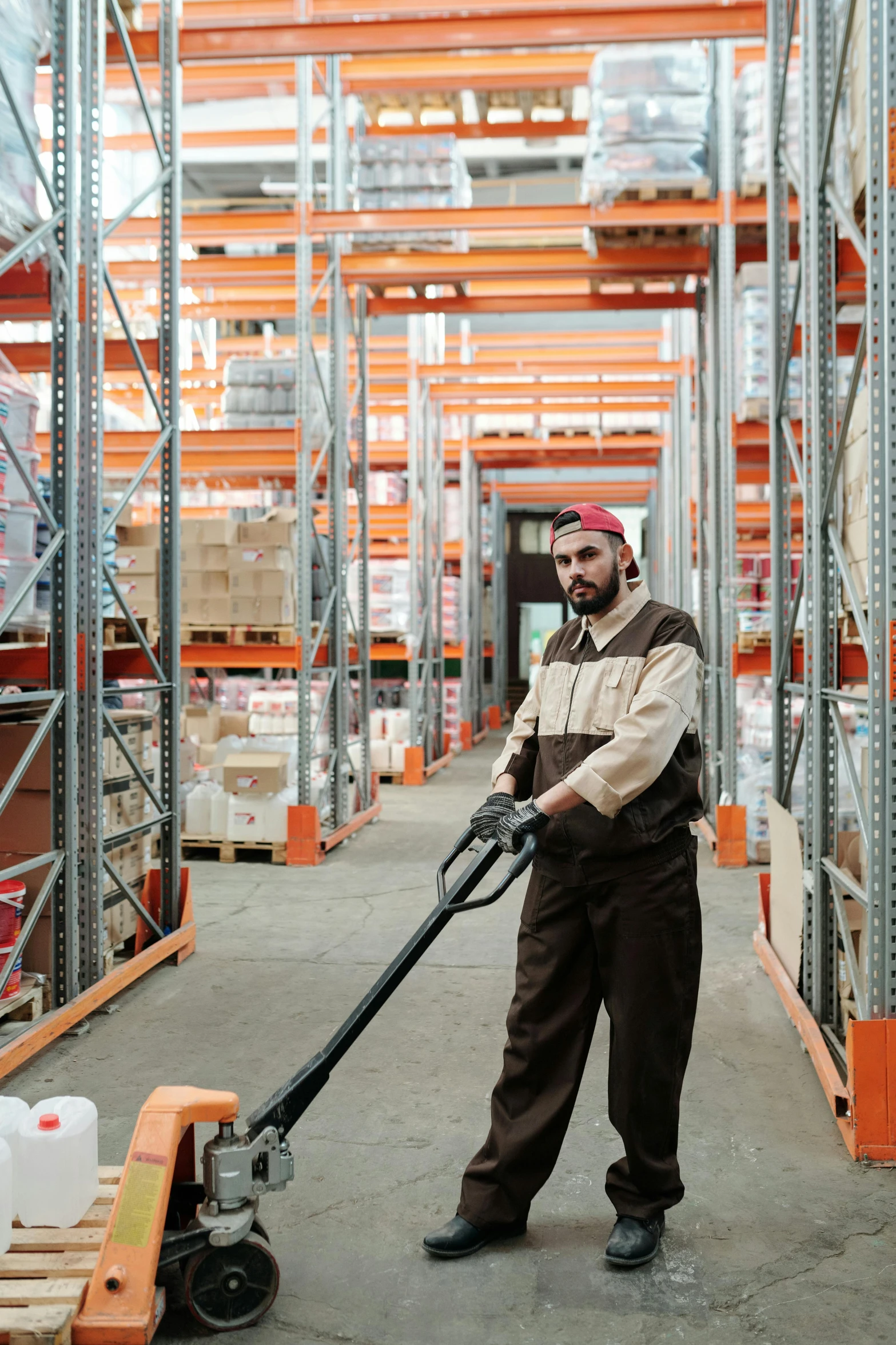 a worker uses a large machine to level the shelves