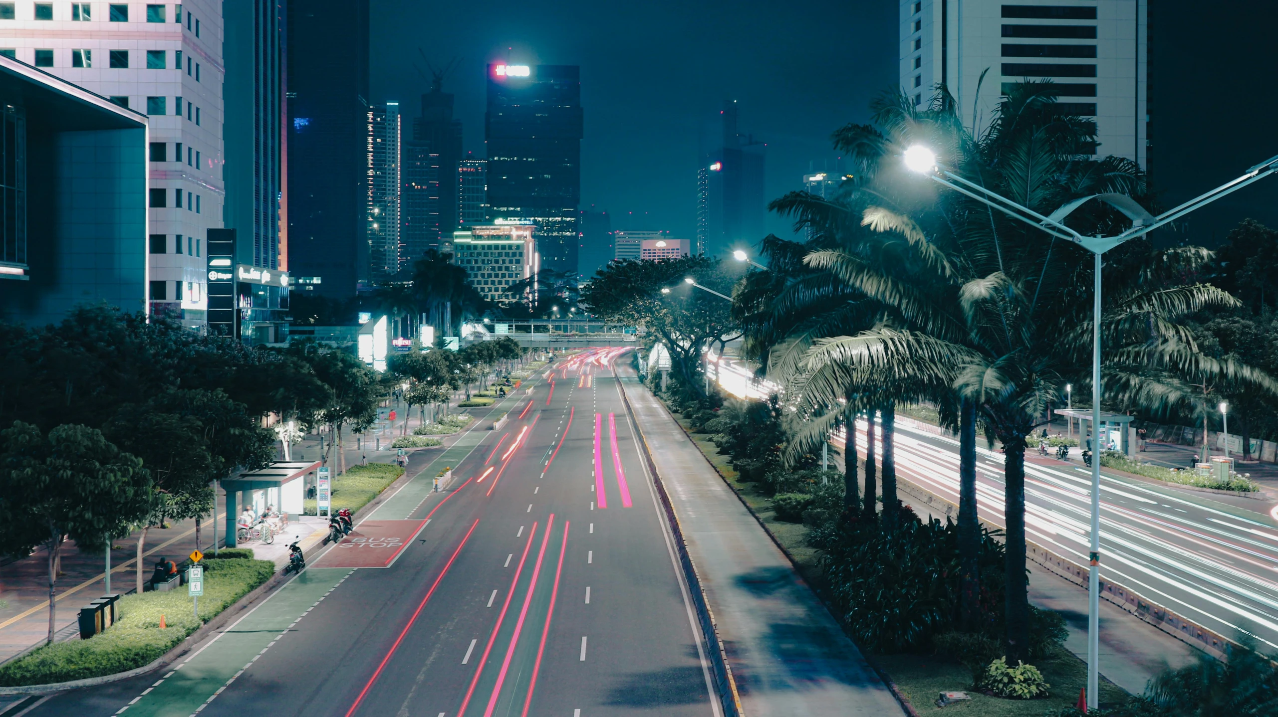 a very long and winding city street at night