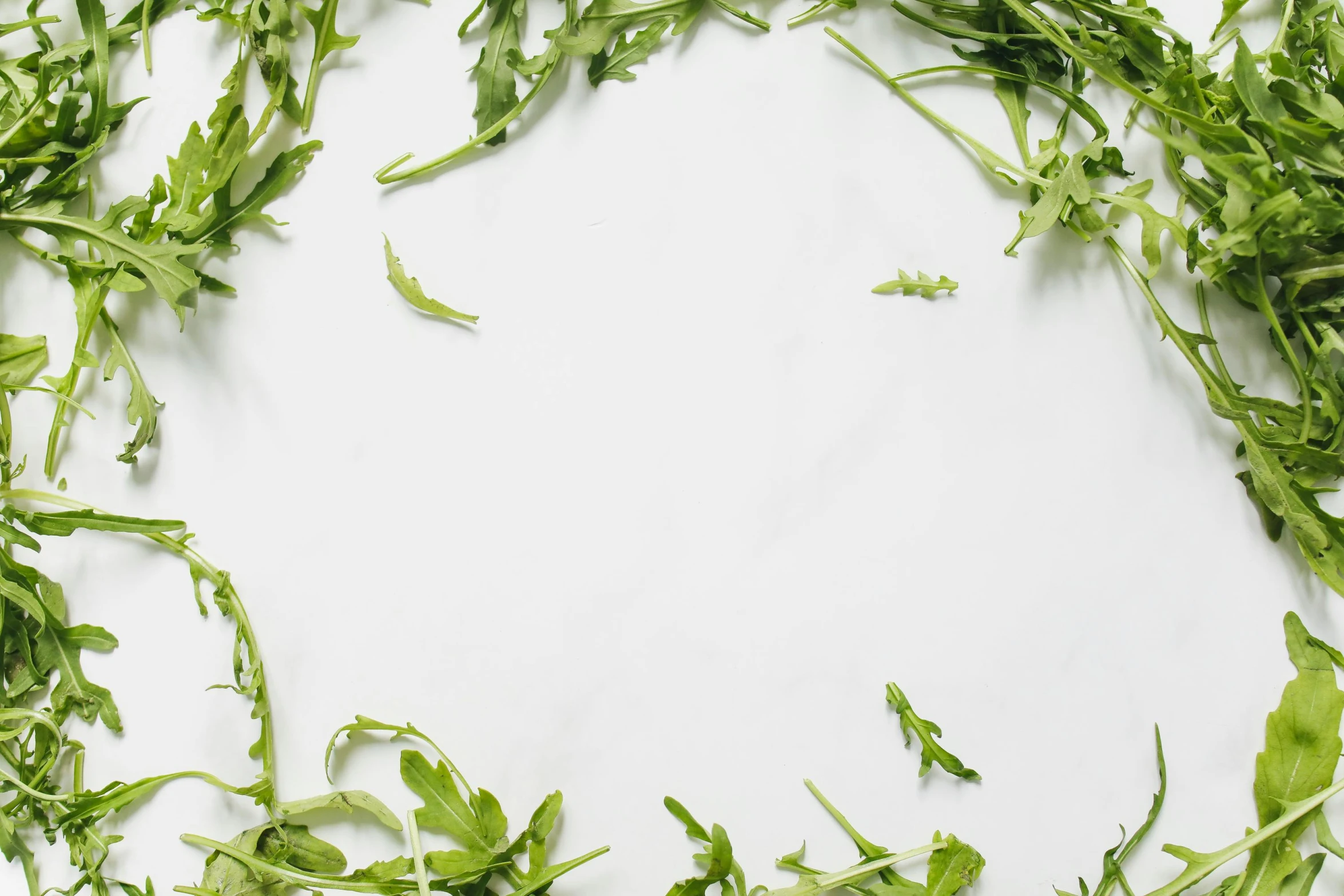 a pile of greens that is sitting on top of a table