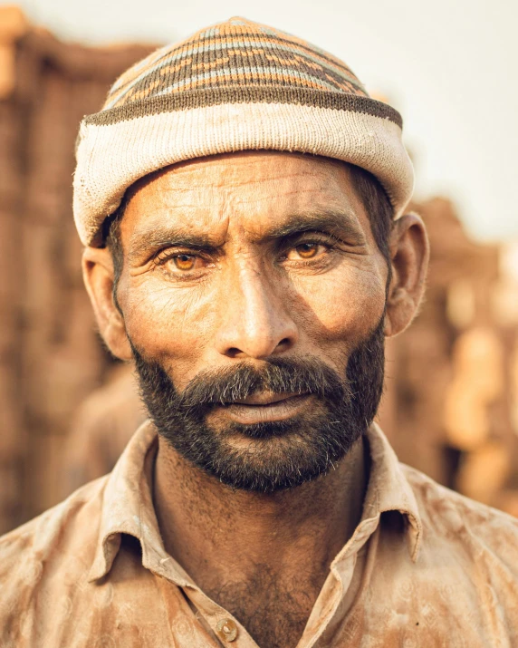 an image of a man with a goatee in a country