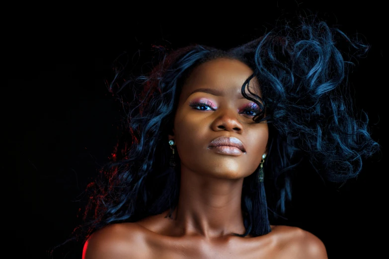 a close up s of a model with curly hair