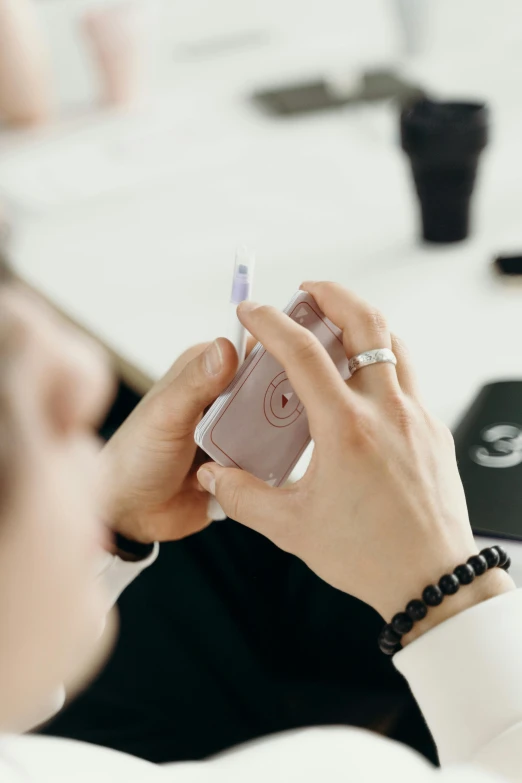 a person holding an electronic device in their hand