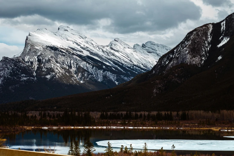 a mountain range with a lake below it