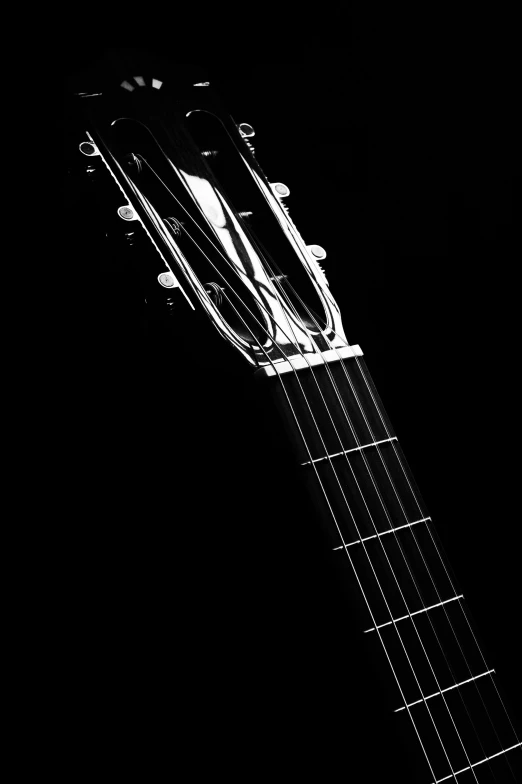 a black and white po of an acoustic guitar