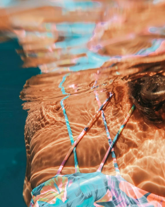 a man is in the pool playing with the waves