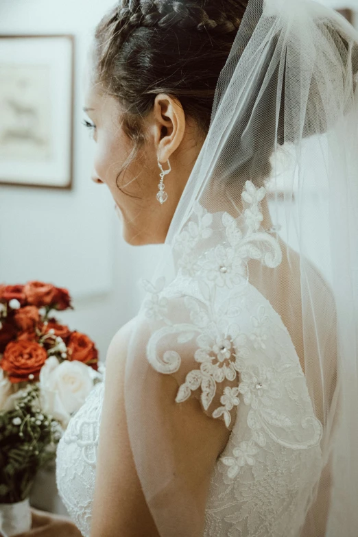 a woman in wedding dress in a room