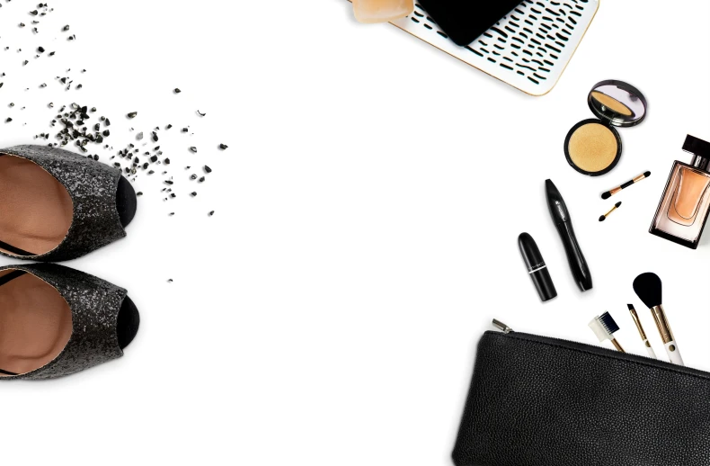 various makeup products lay out on the white surface