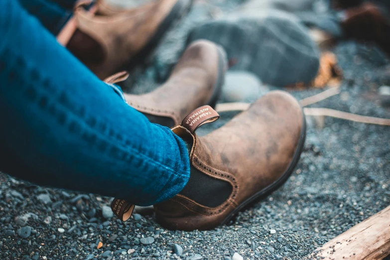 this man is wearing a pair of brown boots