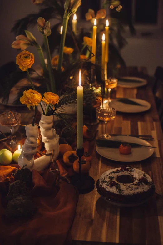 a candle sits on top of a wooden table