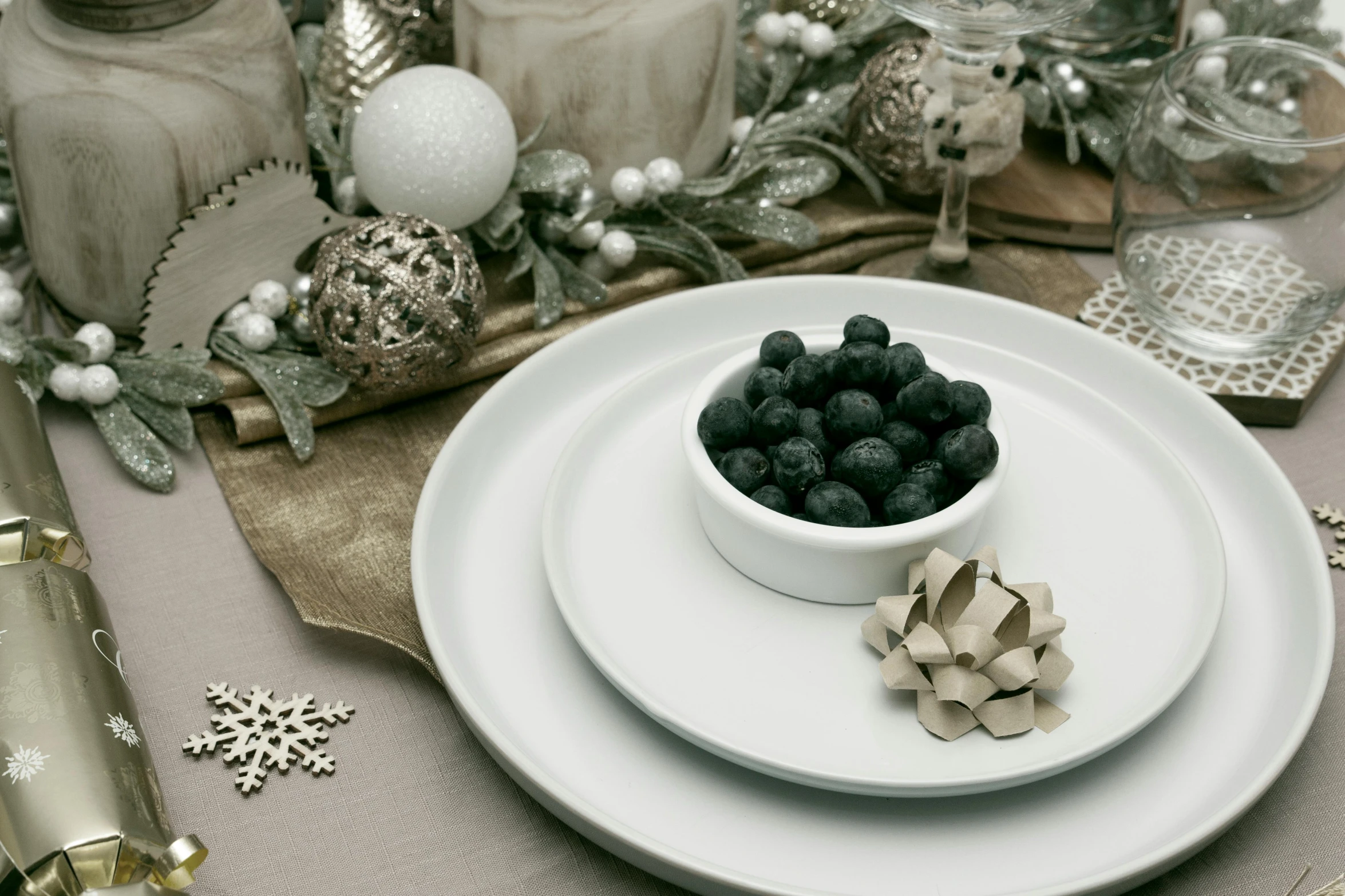 a white plate with christmas decor and other items