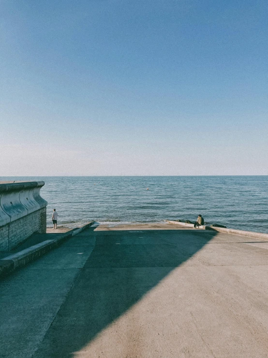 the view of an ocean from a walkway