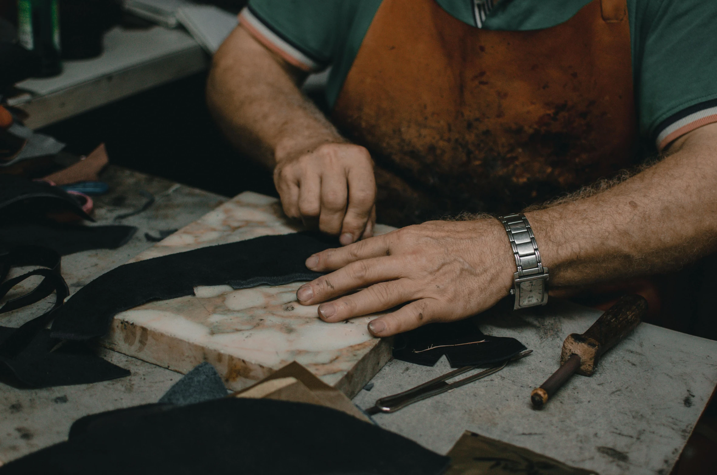 a man is peeling soing with some tools