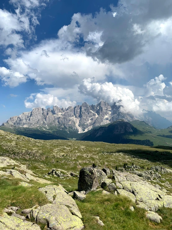 view of mountain tops with sp green grass and rocks