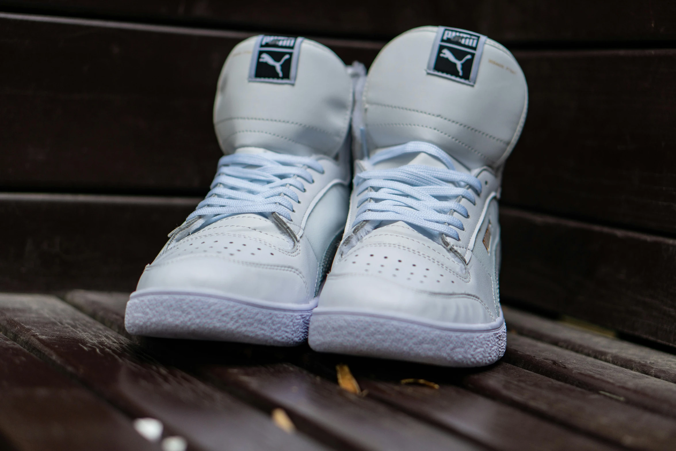 a pair of shoes sits on top of a bench