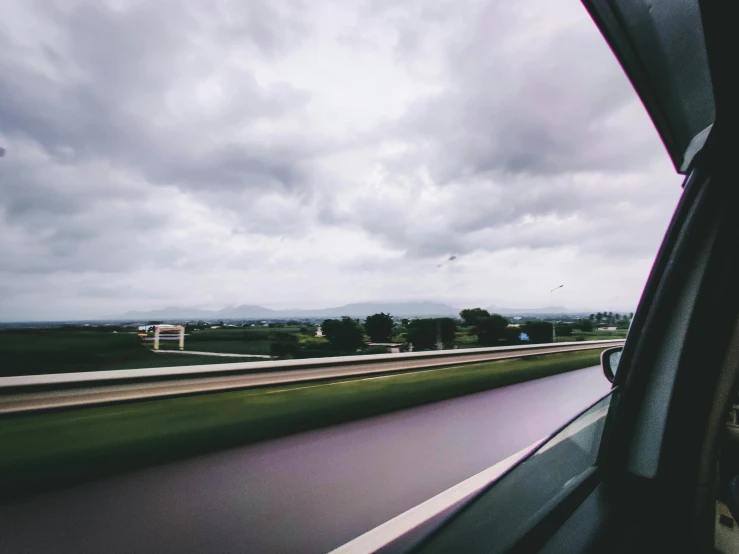 a view out the window of a vehicle on an overcast day