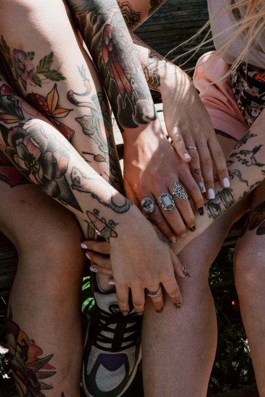 group of tattoos on girls and boy's legs