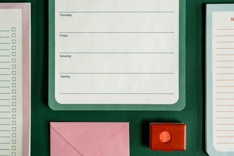 a po of stationery items with a note