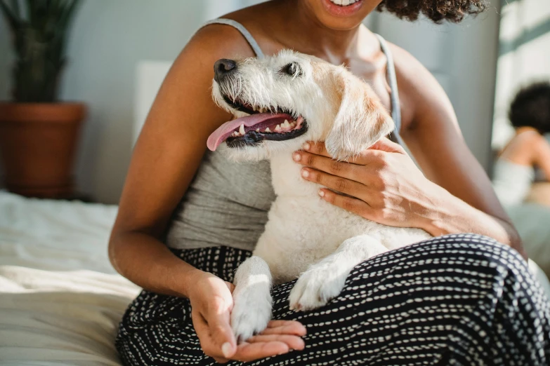 a young woman sitting on top of her dog