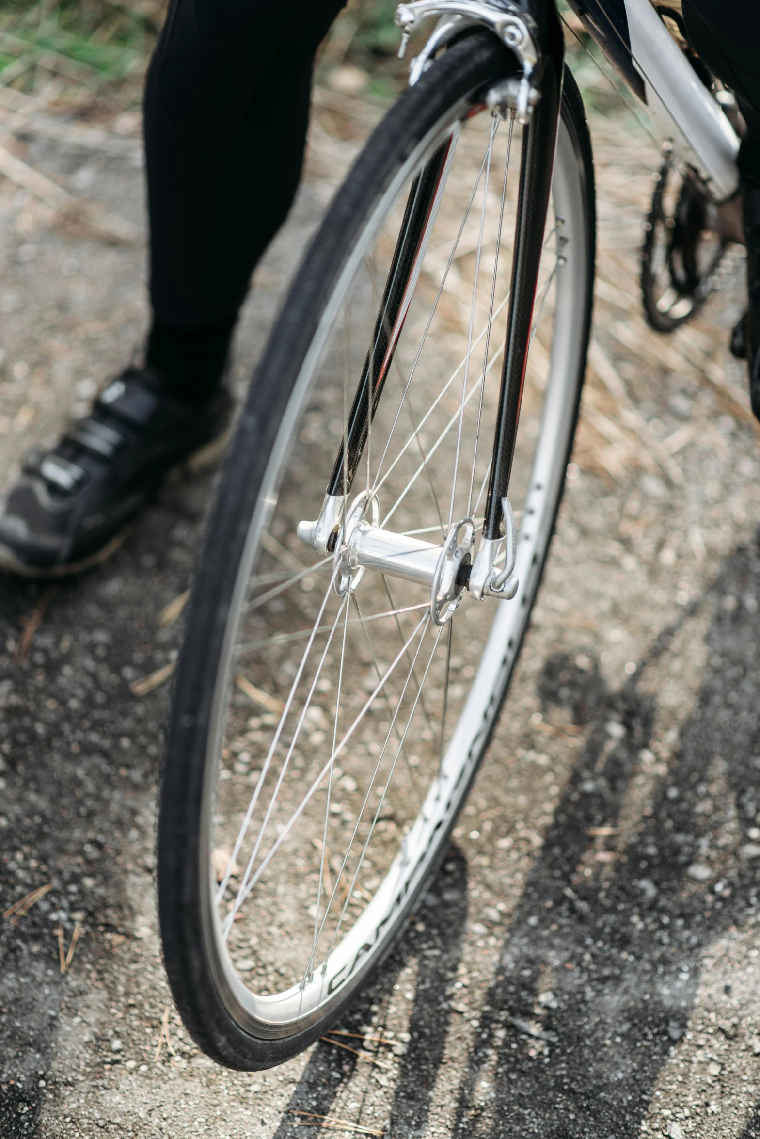 a person is riding a bike on a dirt road