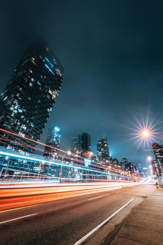 city street lights blur in the distance at night