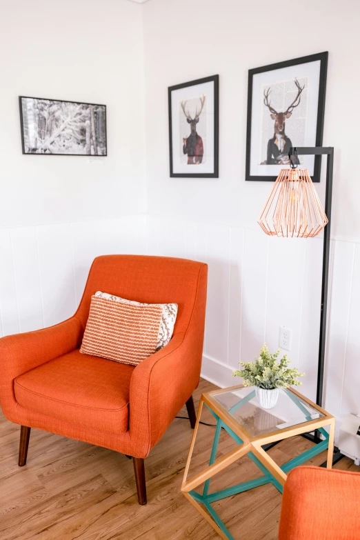 the orange chair and ottoman have different types of pillows on them