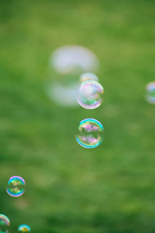 a group of soap bubbles floating through the air