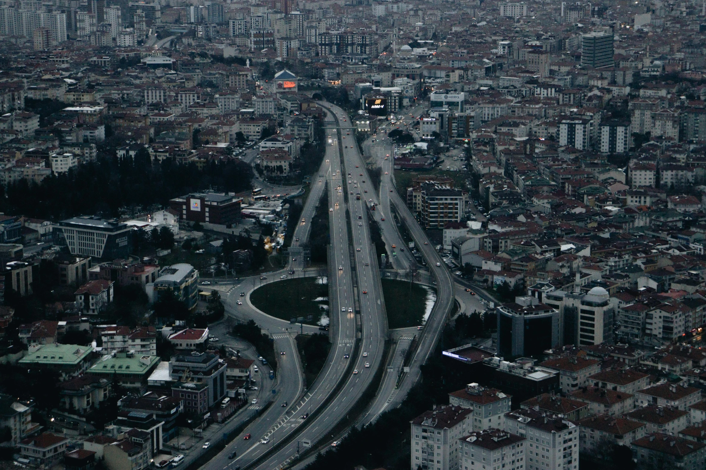 a city is seen from an airplane with cars on it