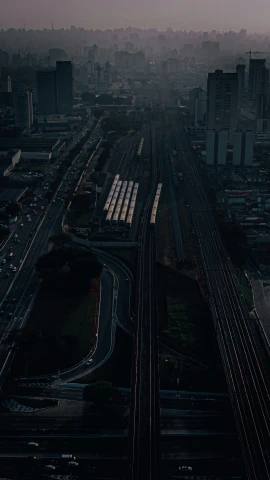 a large city with long train tracks in it