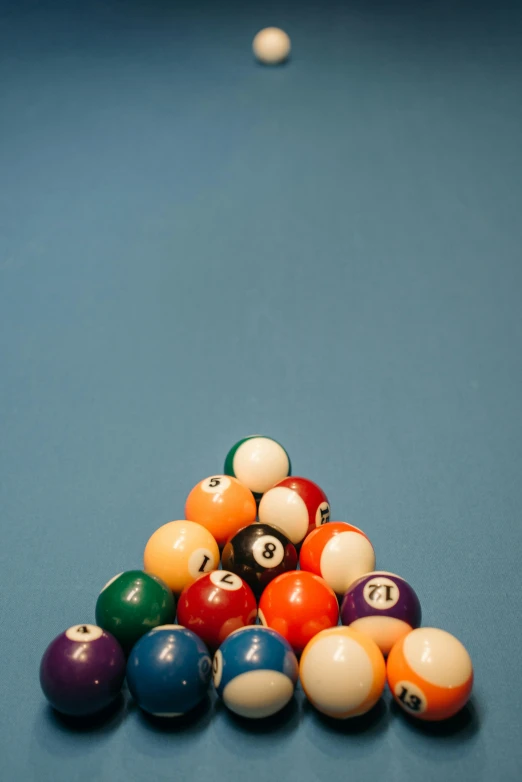 a pool game with cues and billiards