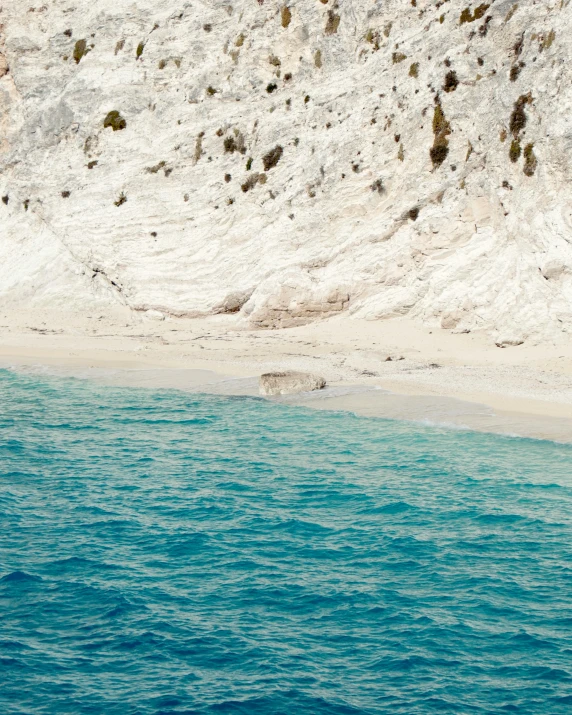 a beautiful watercolor image with a blue ocean and mountain in the background