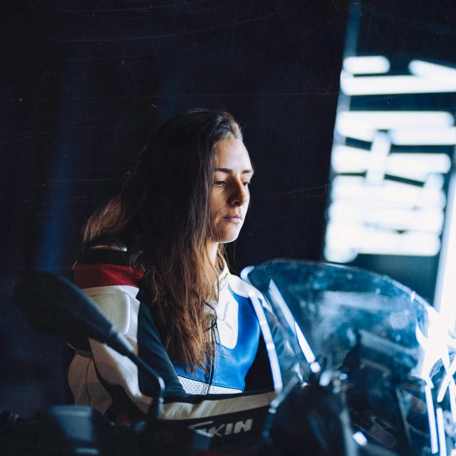 woman on a motorcycle looking into the distance