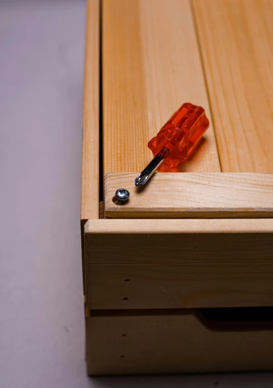 a piece of wood has some glass blocks stuck on it