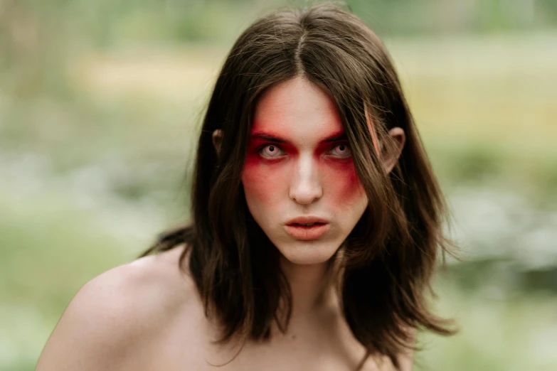 a woman with long hair and red makeup