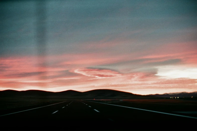 a road with a sky in the background