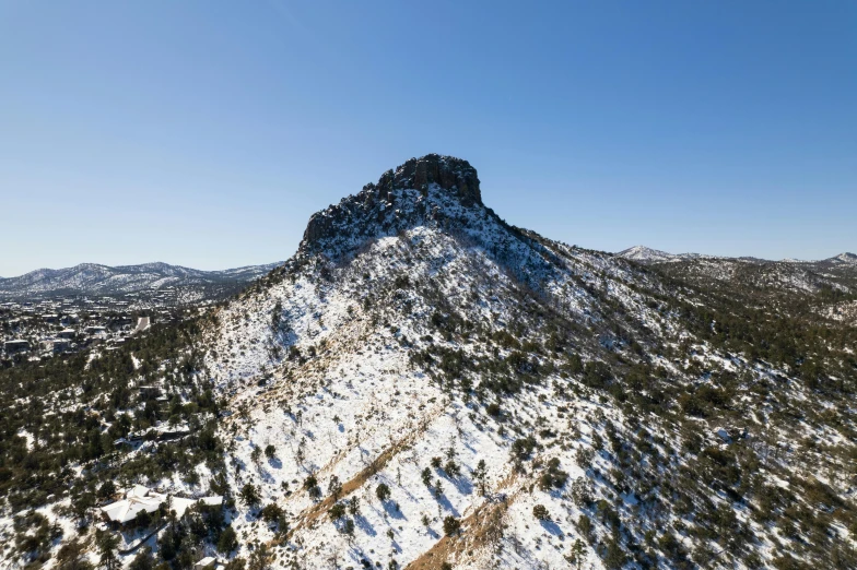 a large mountain with snow on top of it