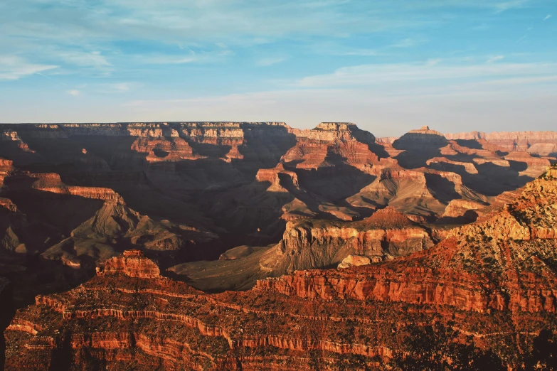 the grand canyon with steep, jagged cliffs is seen