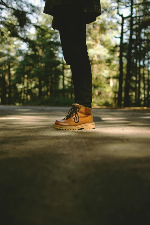 a man's foot on top of a skateboard