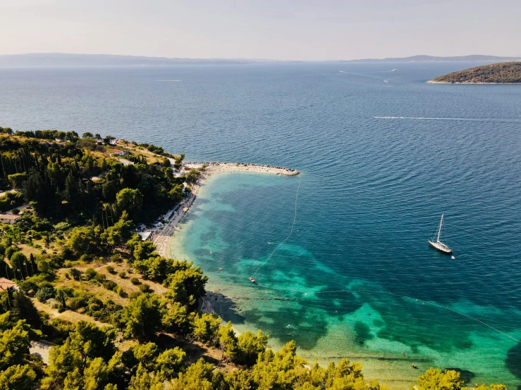 a boat floats on a large body of water