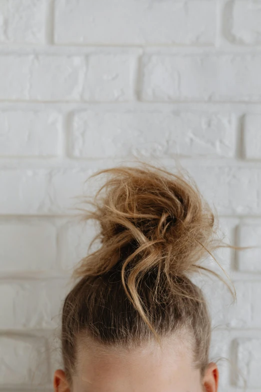 a woman's top knoted bun, seen from the back