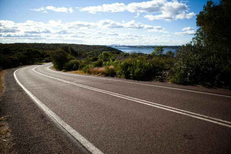 the view from a very long road looks out on to sea