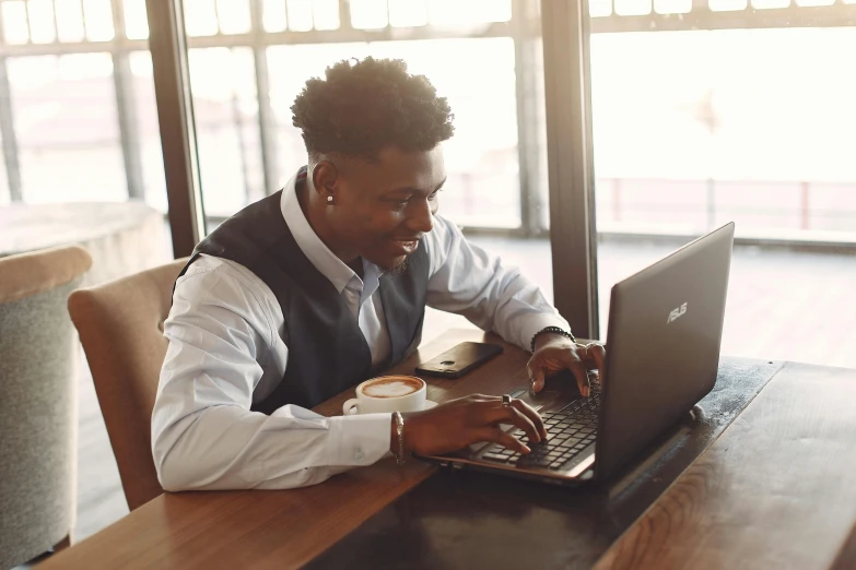 a person that is typing on a laptop