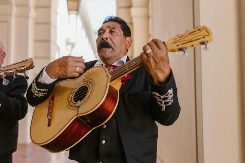 an image of two people that are playing guitar