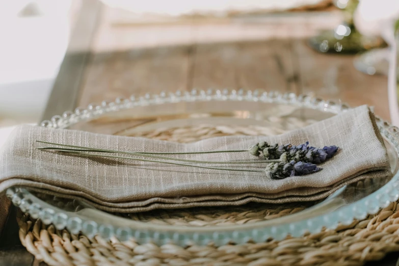 a basket that is filled with flowers and some sort of cloth