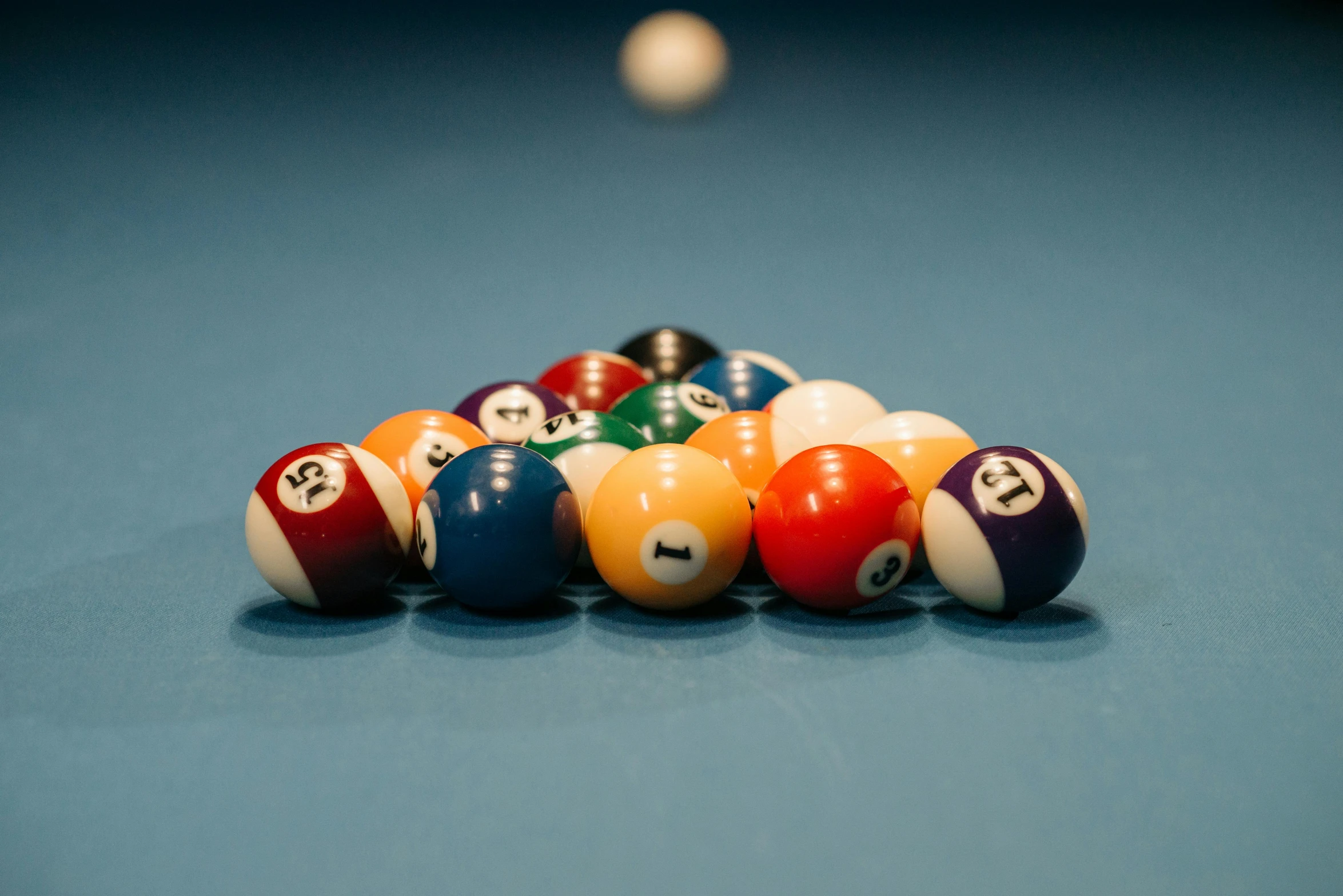 a pool table with nine balls in a row