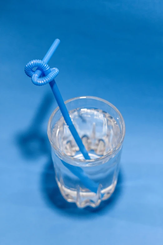 an unopened glass containing an ointment for toothbrushes