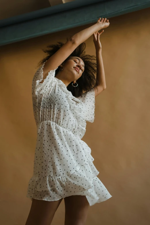 a woman is holding onto a surfboard