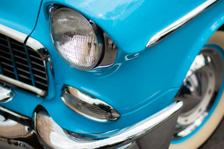 a closeup of the front end of a blue car