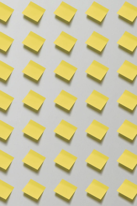 a pattern of yellow pieces of sticky note