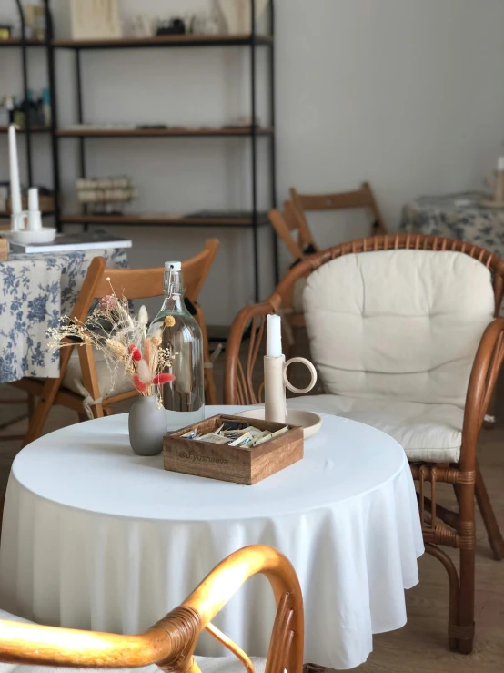 an open room with table and chairs that are on the floor